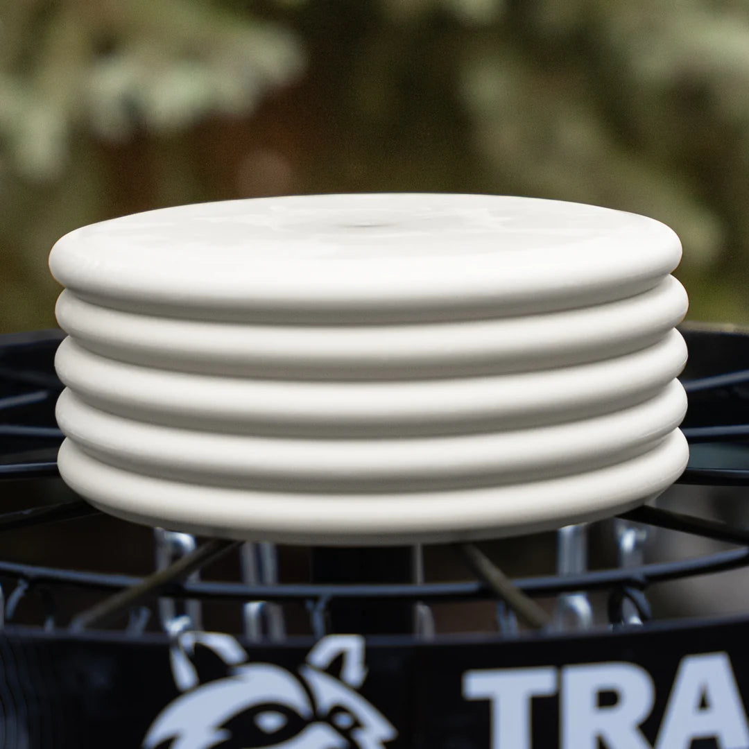 Off White - Trash Panda Inner Core recycled premium putter disc 5 stack on a disc golf basket.