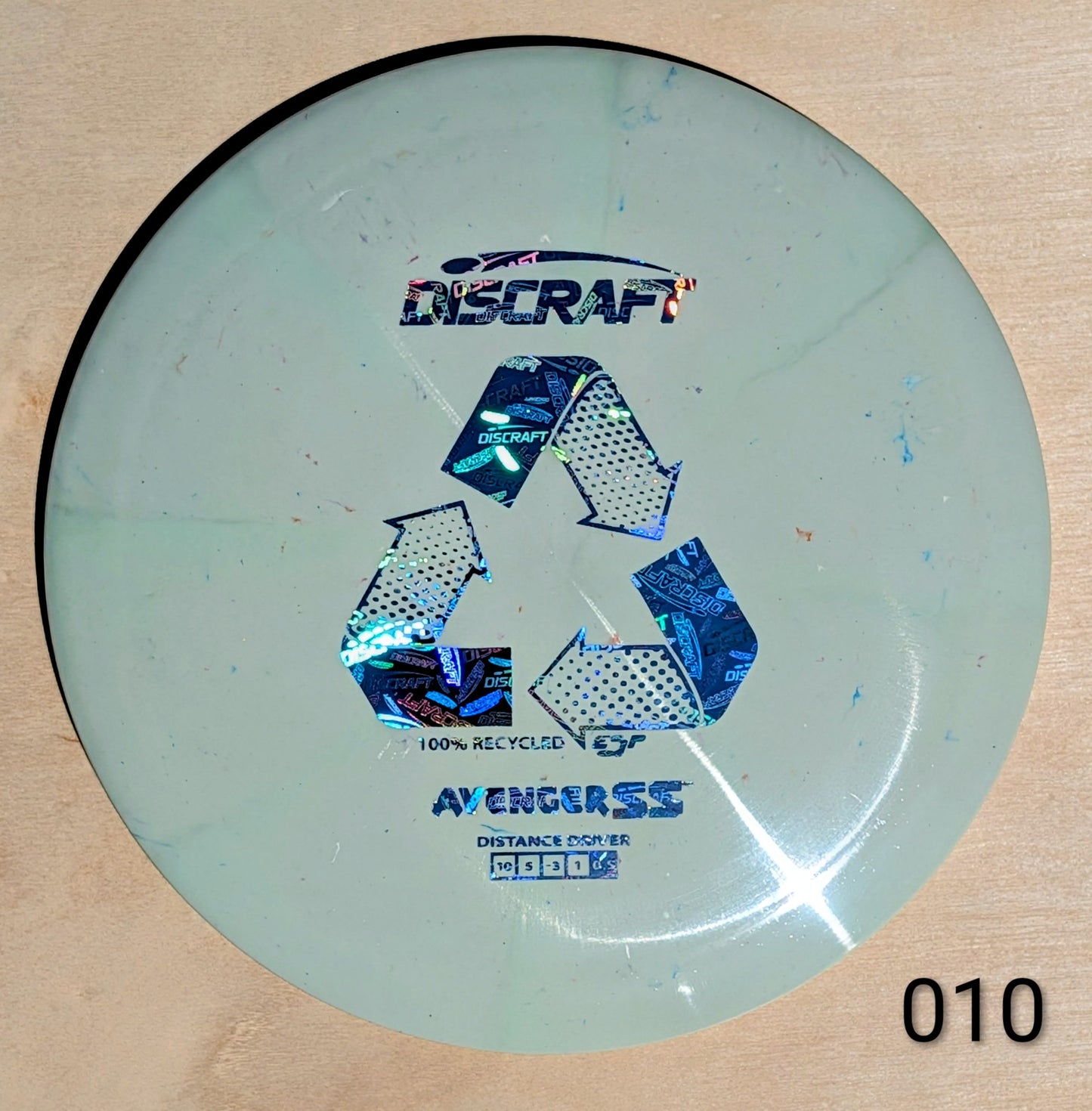 Discraft Avenger SS disc golf disc on a wooden surface