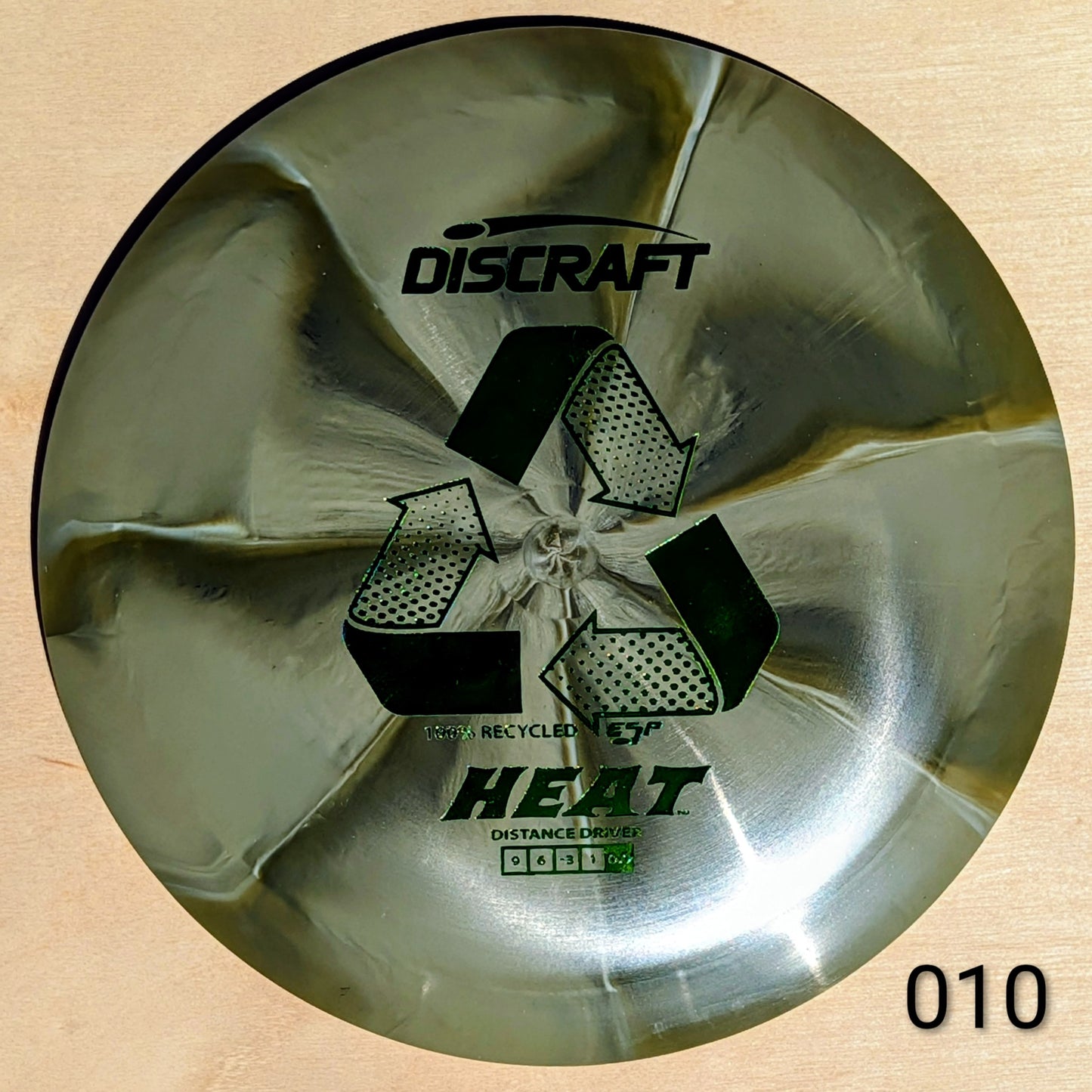 Discraft Heat disc golf disc on a wooden surface