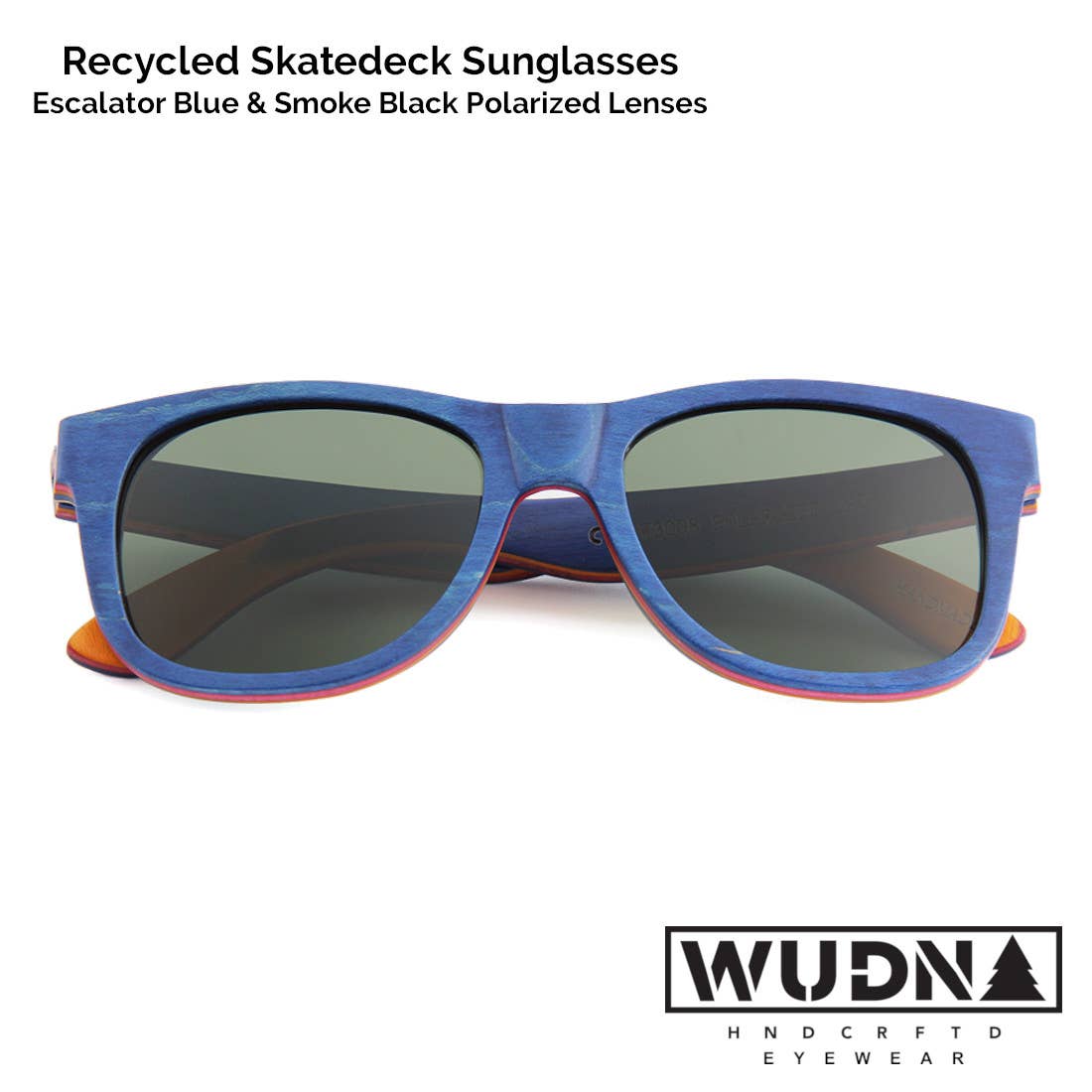 Escalator blue Recycled skatedeck sunglasses with blue frame and dark lenses on a white background, featuring WUDN logo.