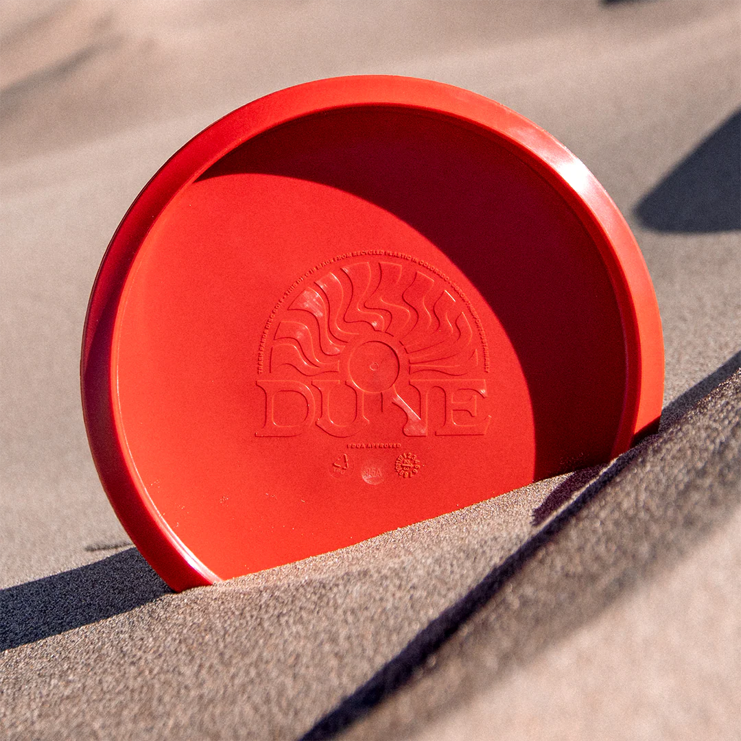 cherry - Trash Panda Dune recycled premium midrange disc golf disc in cherry