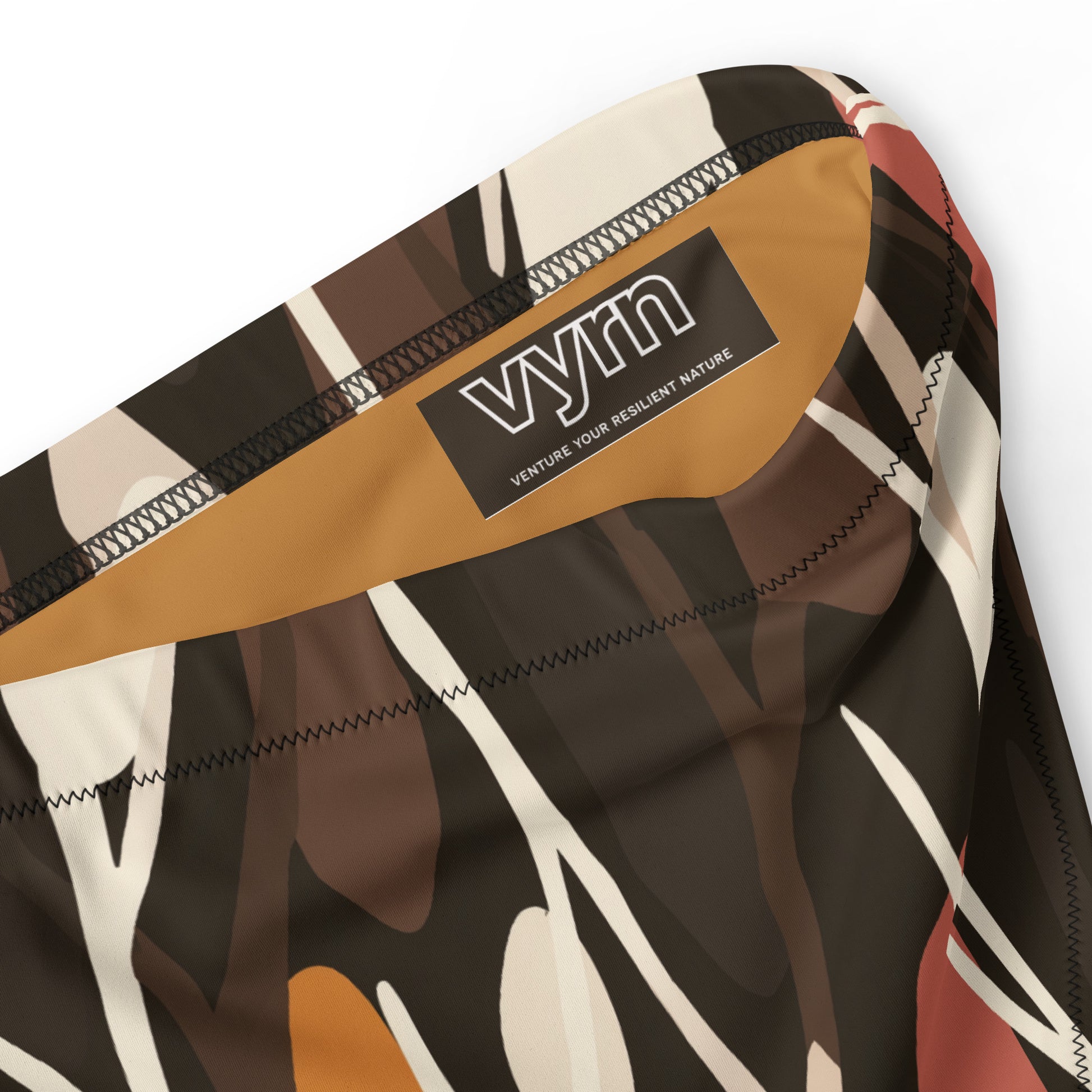 TANGLED ROOTS Close-up detail showing the secure anti-slip lining and the VYRN logo on Tangled Roots Bikini Bottom