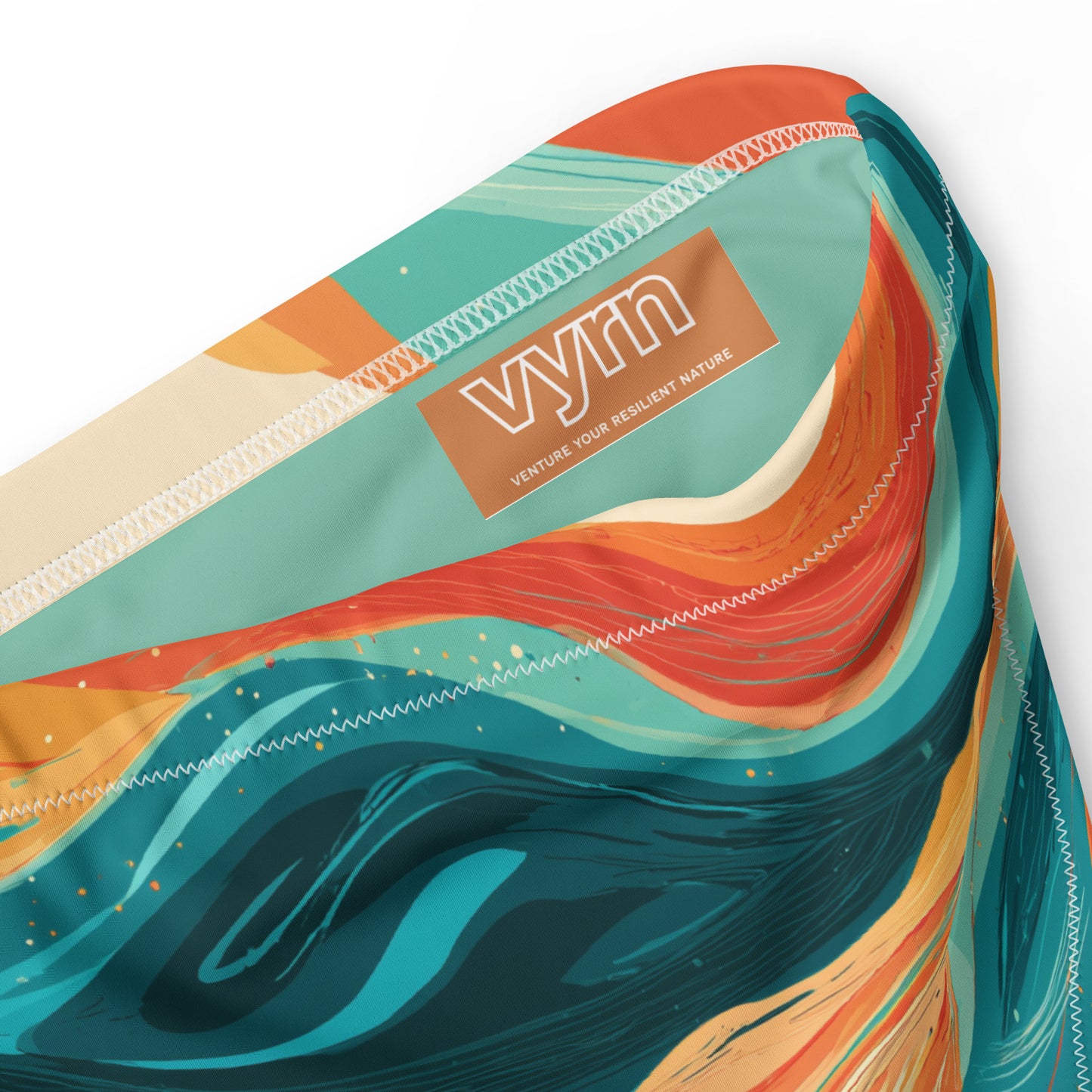 EMBER TIDE Close-up detail showing the secure anti-slip lining and the VYRN logo on Ember Tide Bikini Bottom