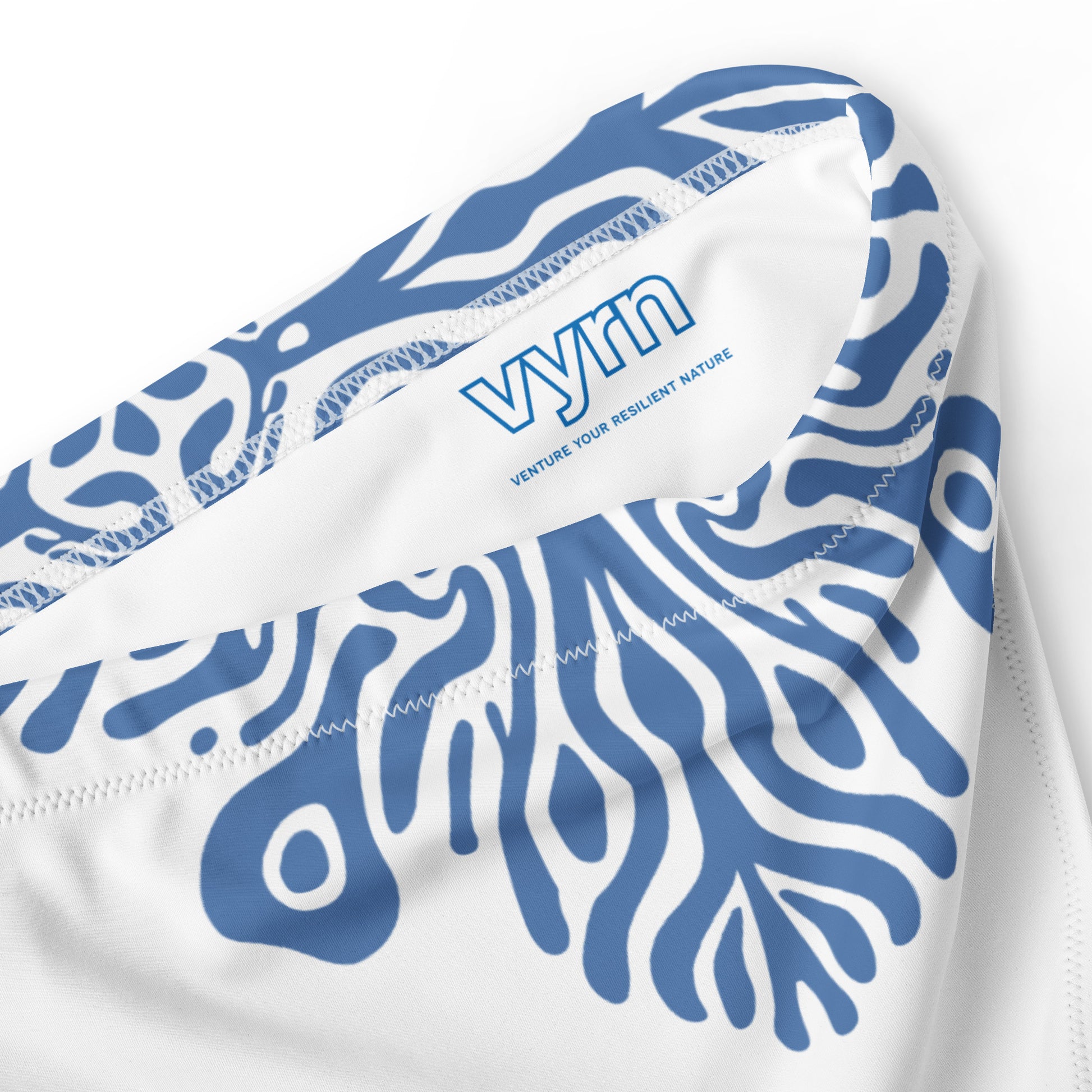 MIDNIGHT REEF Close-up detail showing the secure anti-slip lining and the VYRN logo on Midnight Reef Bikini Bottom