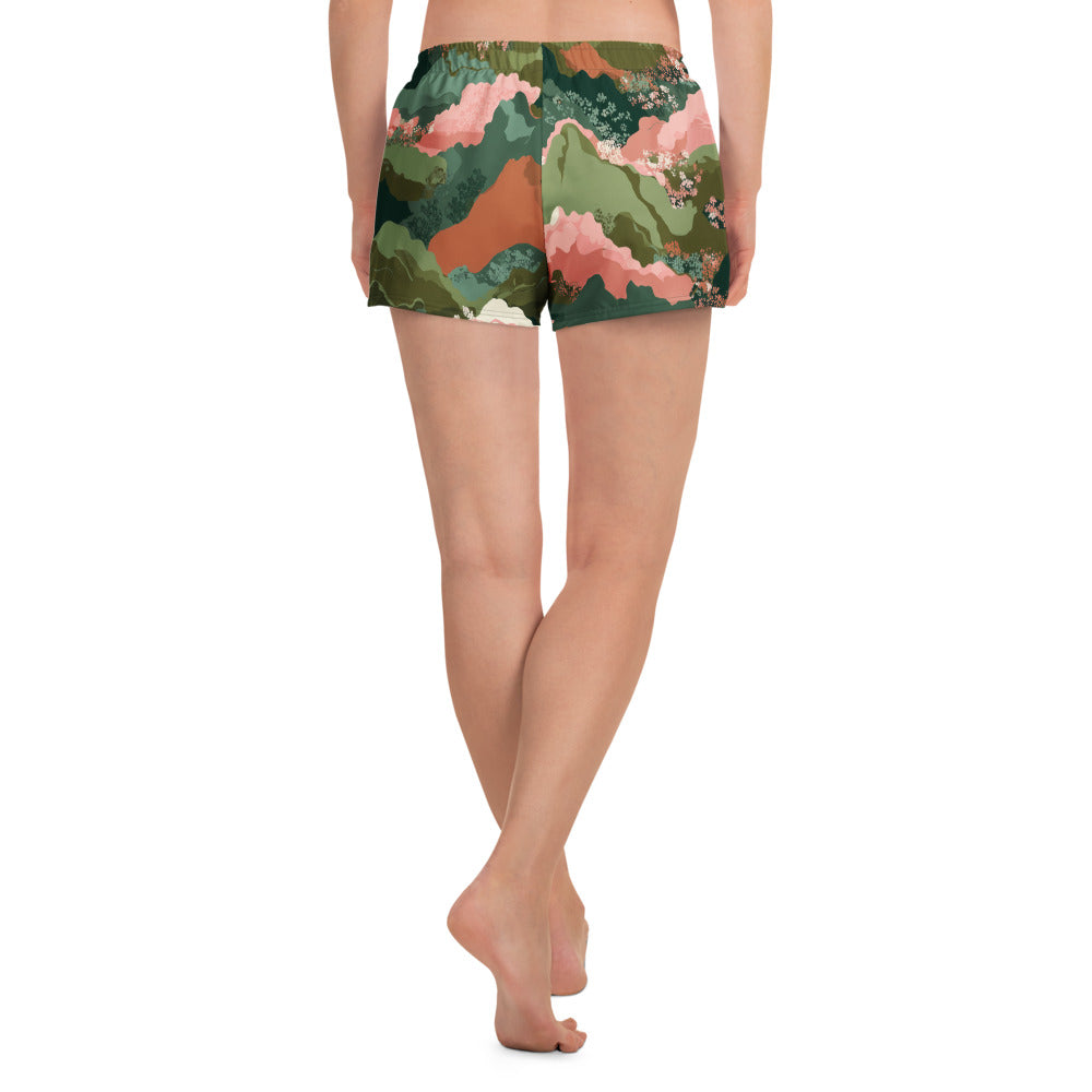 Olive Bloom Floral patterned shorts worn by a person on a white background