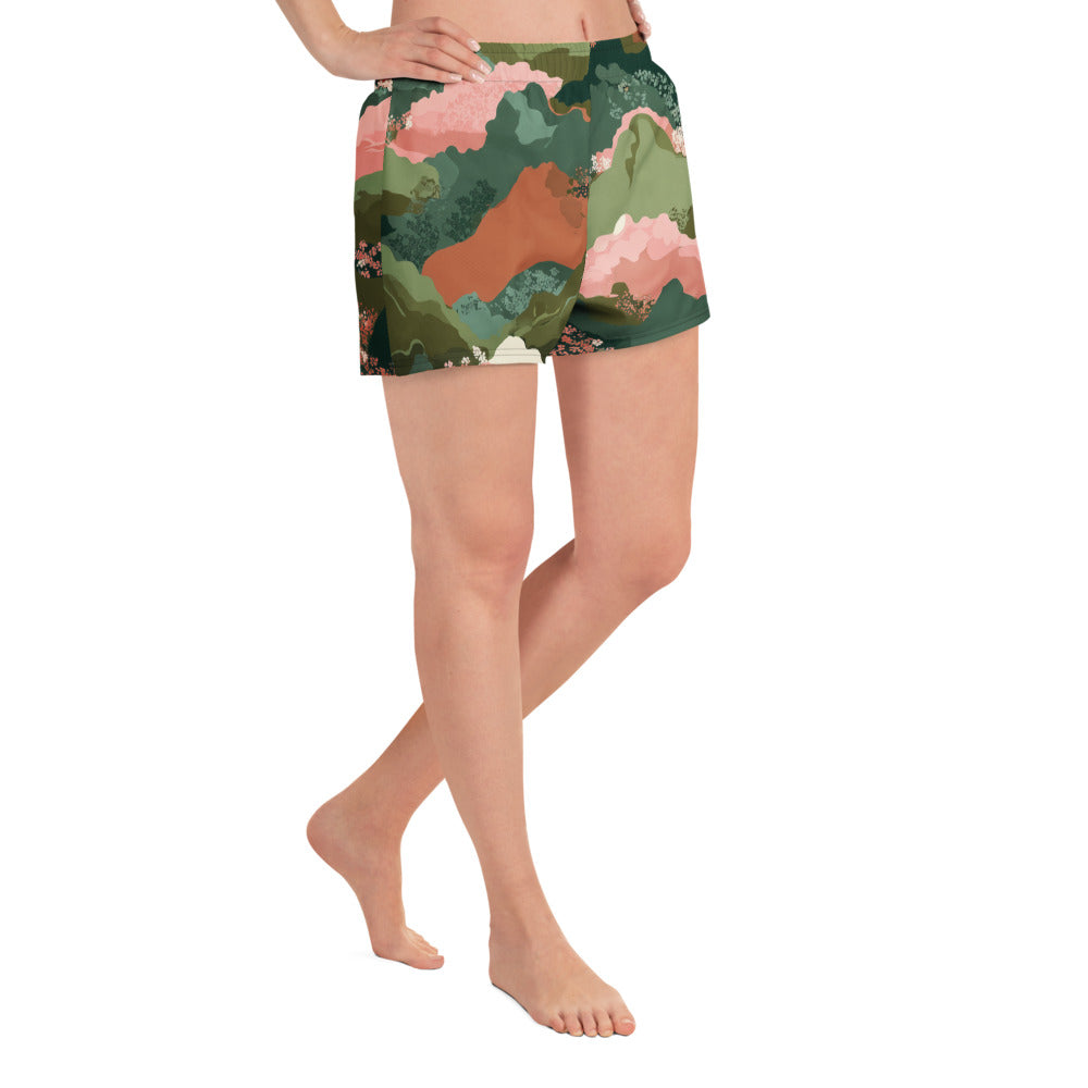 Olive Bloom Person wearing a pair of colorful shorts on a white background