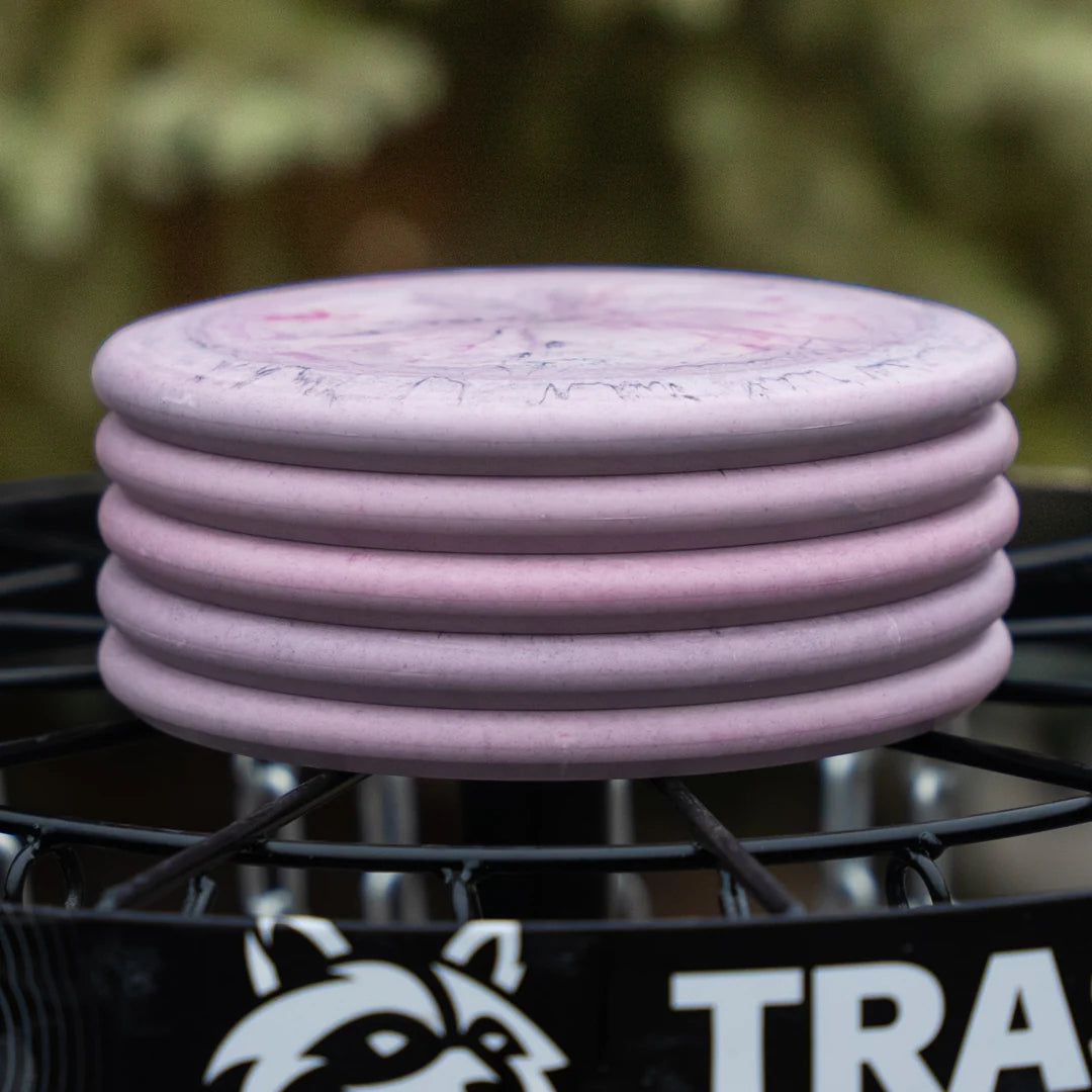 Geode Swirl - Trash Panda Inner Core recycled premium putter disc 5 stack on a disc golf basket. 