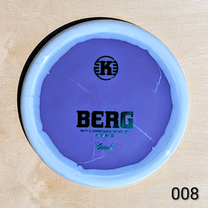 Purple disc with 'BERG' branding on a beige background