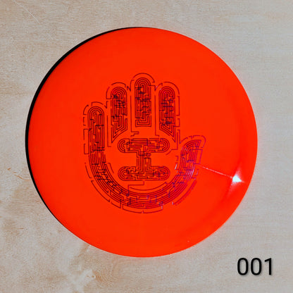 Orange disc with black hand design on a beige background