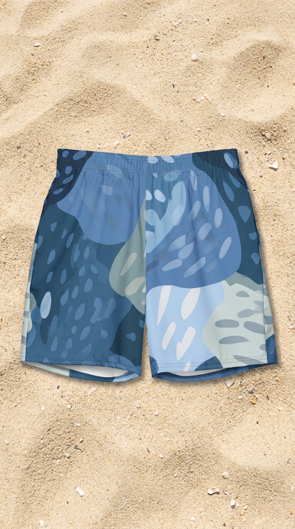 Lagoon Rise patterned shorts on a sandy surface