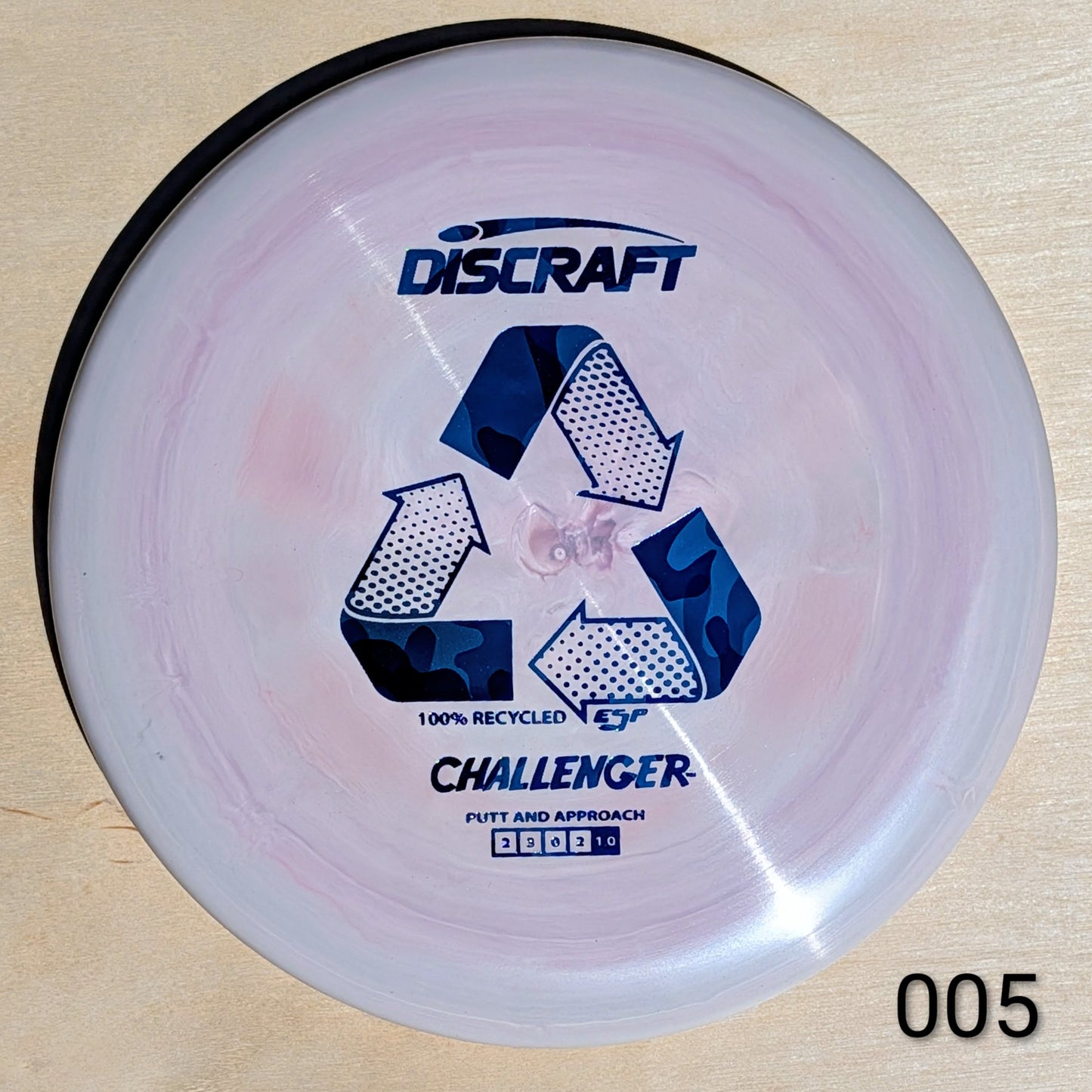 Discraft Challenger disc golf disc on a beige background