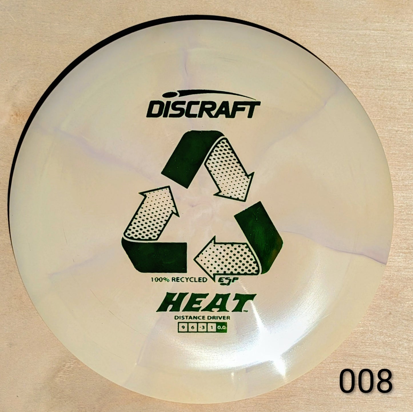 Discraft Heat disc golf disc on a wooden surface