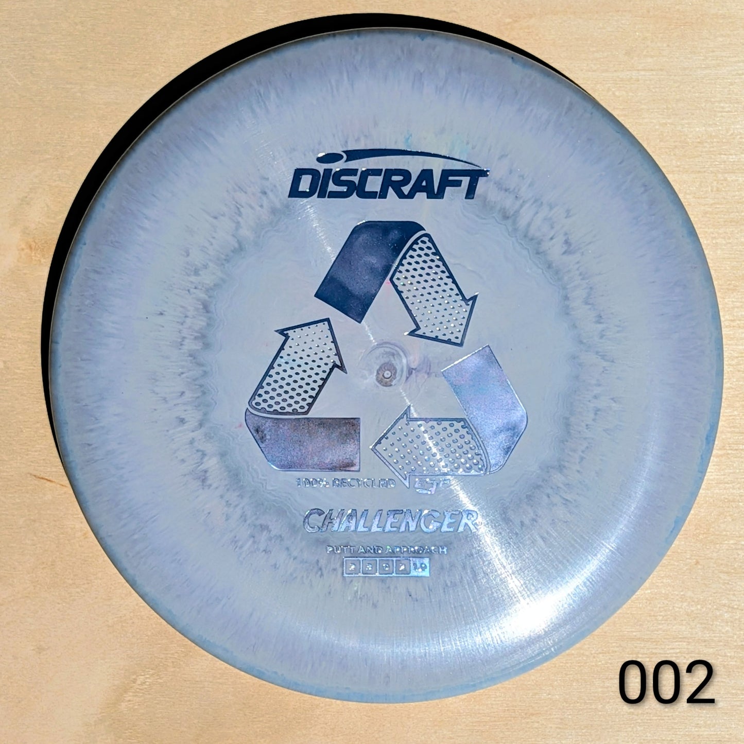 Discraft Challenger disc golf disc on a wooden surface