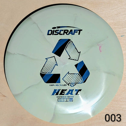 Discraft Heat disc golf disc on a wooden surface