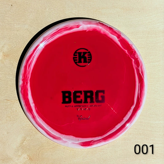 Red disc with 'BERG' branding on a beige background