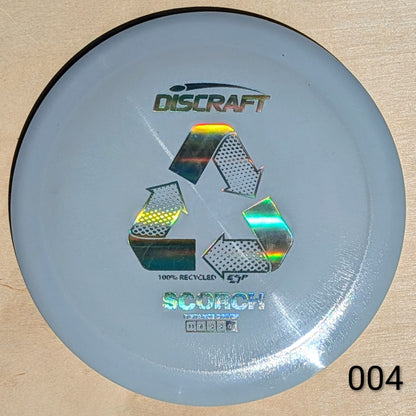 Discraft Scorch disc golf disc on a beige background