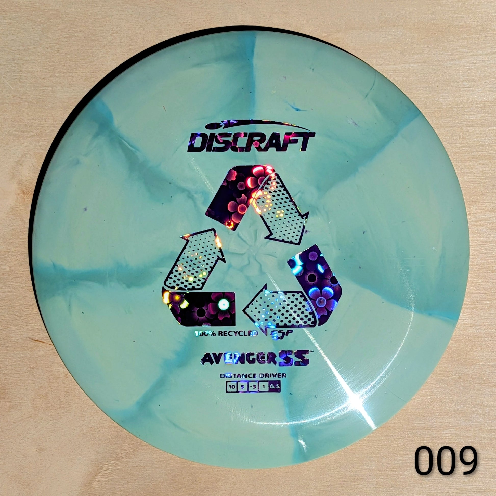 Discraft Avenger SS disc golf disc on a beige background
