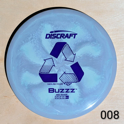 Discraft Buzzz disc golf disc on a wooden surface