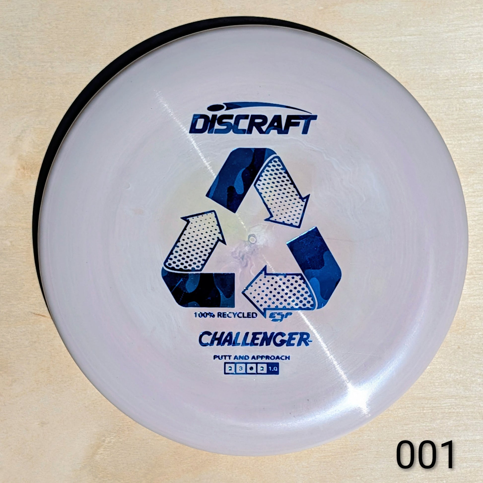 Discraft Challenger putter disc on a wooden surface