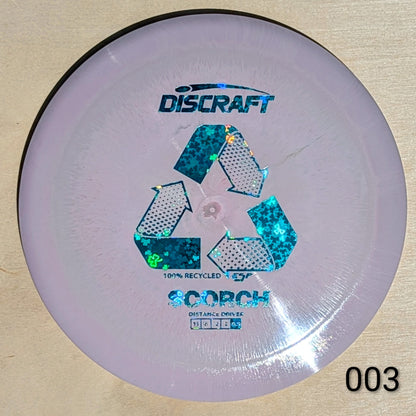 Discraft Scorch disc golf disc on a beige background