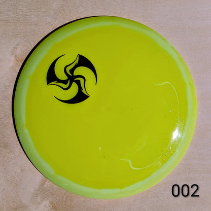 Green disc with a black logo on a beige background