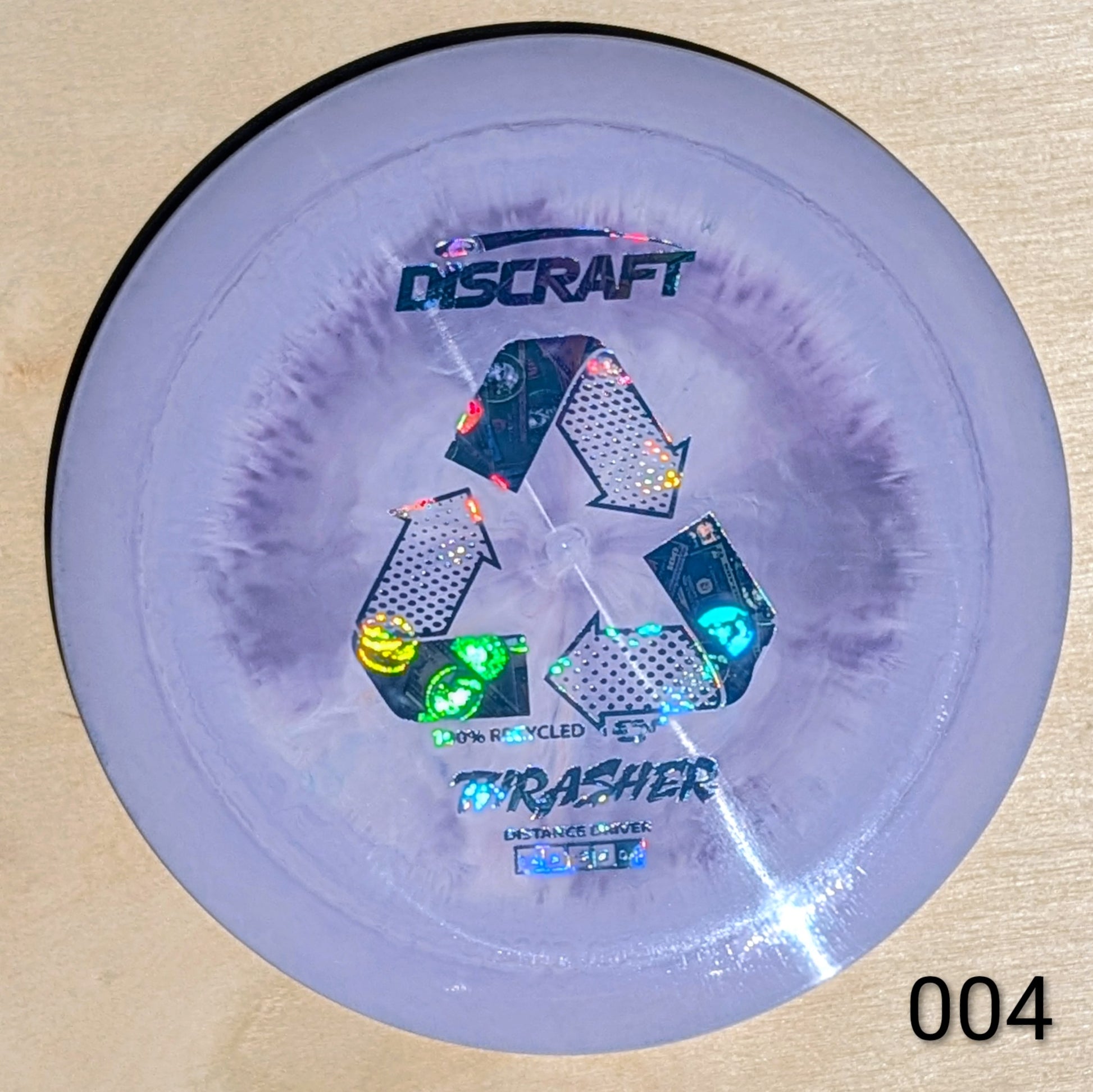 Discraft Thrasher disc golf disc on a beige background