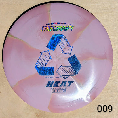 Pink disc with blue recycling symbols and text on a beige background