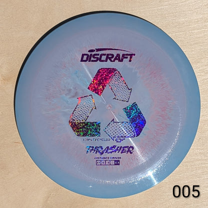 Discraft Thrasher disc golf disc on a beige background