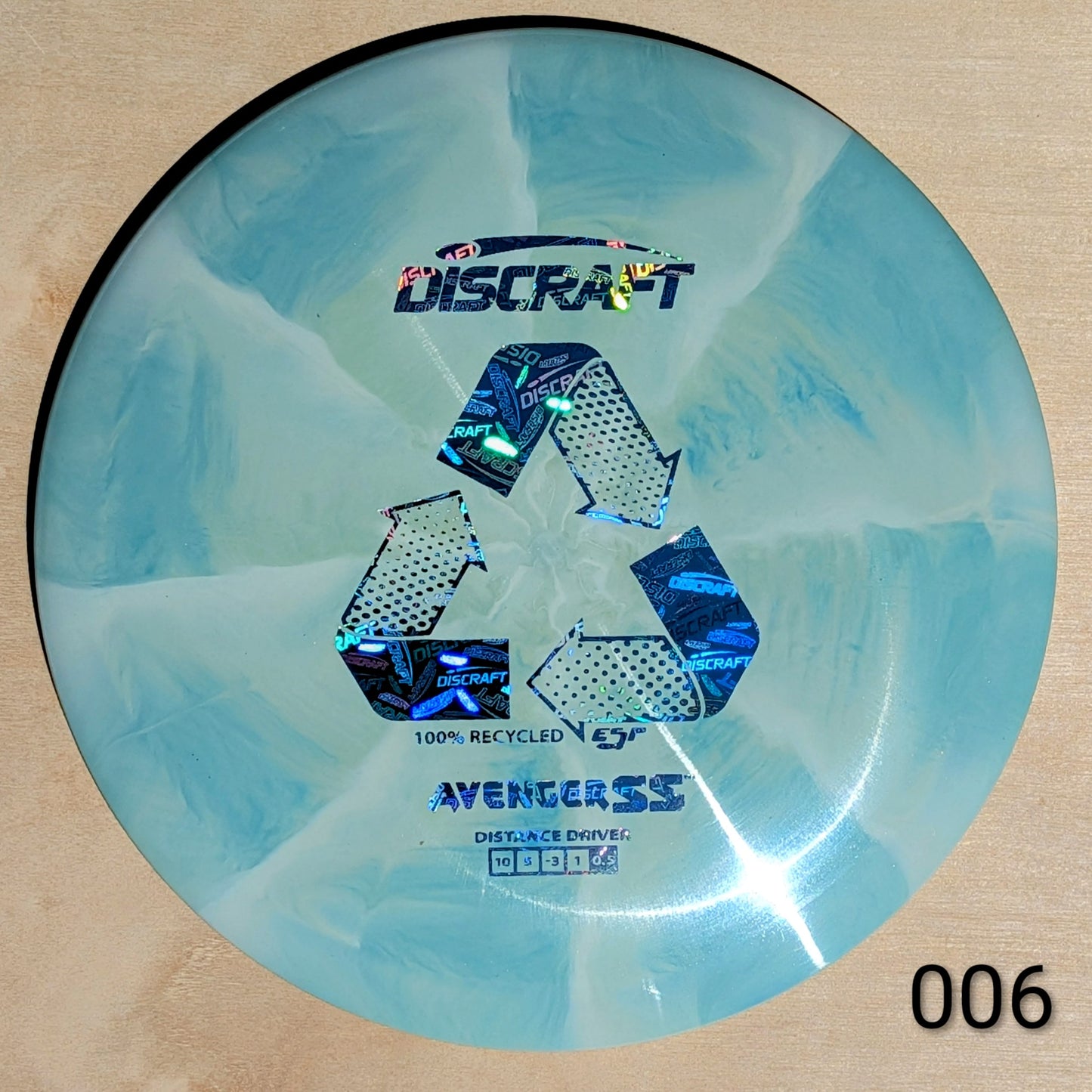 Discraft Avenger SS disc golf disc on a beige background