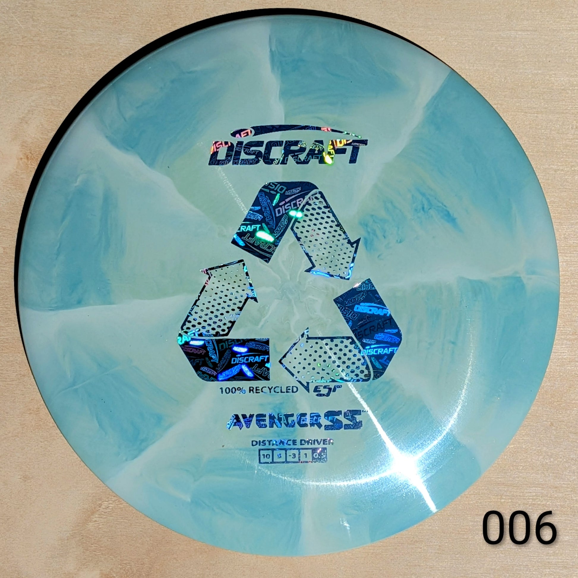 Discraft Avenger SS disc golf disc on a beige background