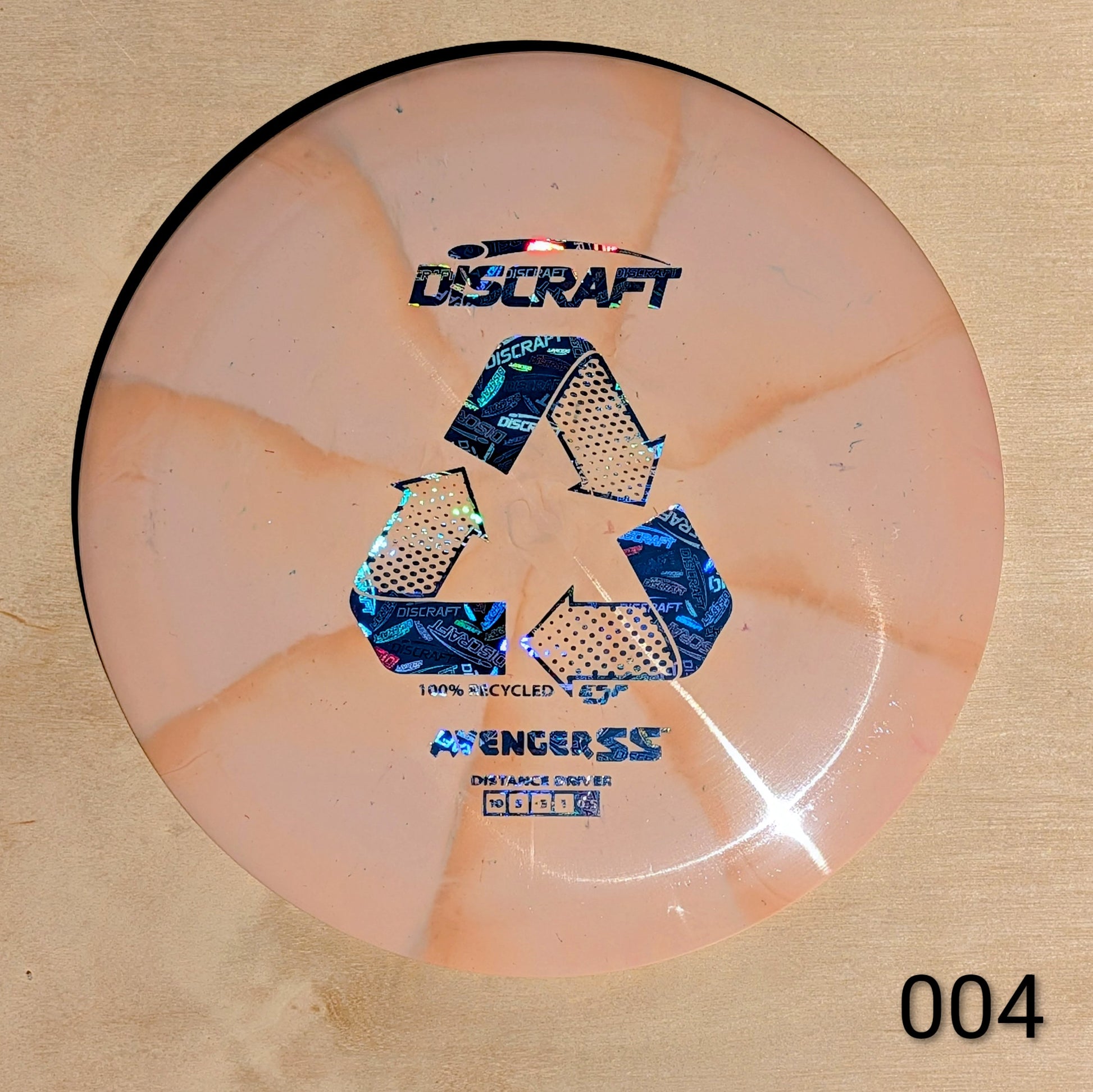 Discraft disc on a beige background