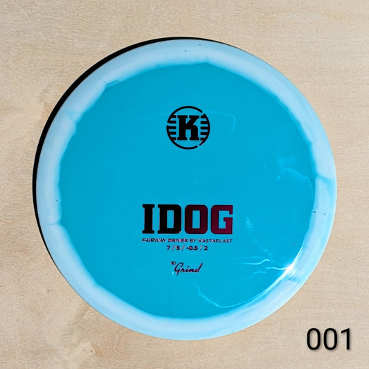 Blue disc golf driver with 'K' logo and text on a beige background