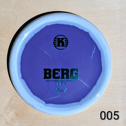 Purple disc with 'BERG' branding on a beige background