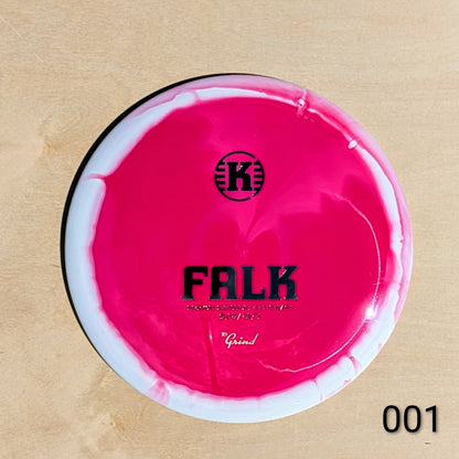 Pink and white disc with 'K' logo and text on a beige background