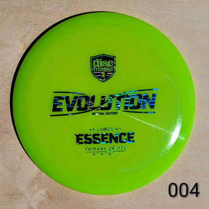Green disc golf disc with 'Discmania' logo and text on a beige background